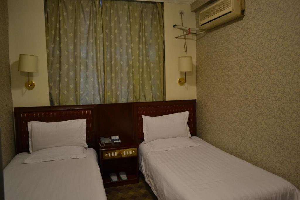 Saint Angel Hotel Peking Zimmer foto